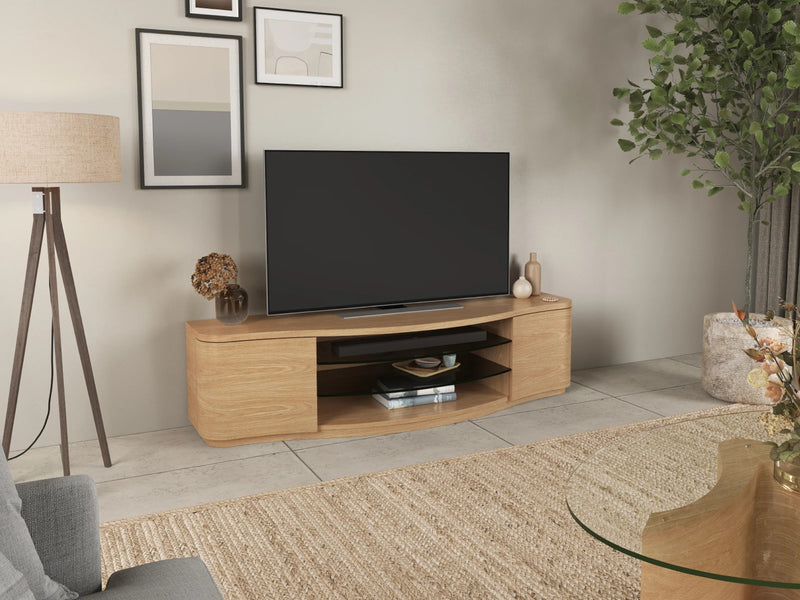 Light wood TV stand with a black TV, two cabinets, and an open shelf in the middle.
